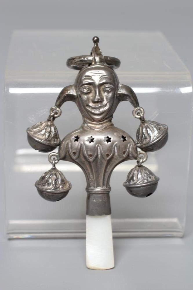 A SILVER RATTLE/TEETHER by Wilmot Man. Co., Birmingham 1918, in the form of a jester with four bells Image