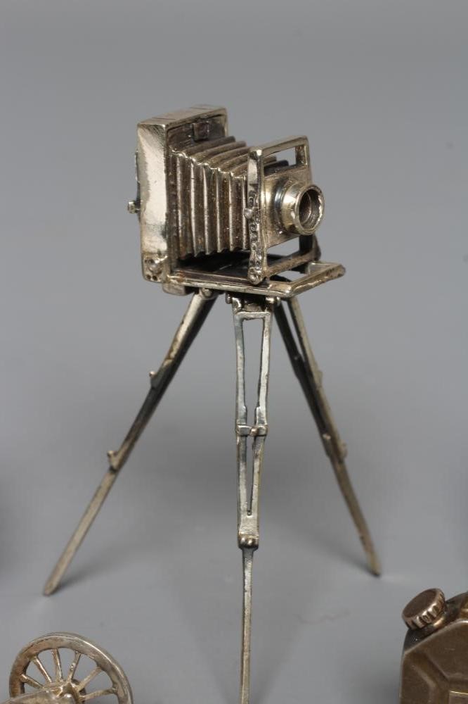 A MODERN SILVER MINIATURE MODEL TRIPOD PLATE CAMERA Image