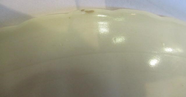 A CHINESE WHITE GLAZED PORCELAIN DISH of fluted circular form centrally carved with a crane in Image