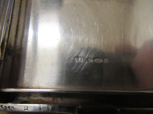 AN ART DECO SILVER COMPACT imported by Stockwell & Co. Image