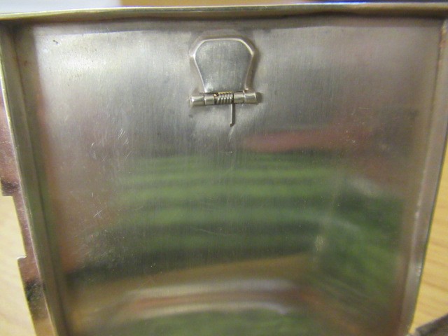 AN ART DECO SILVER COMPACT imported by Stockwell & Co. Image