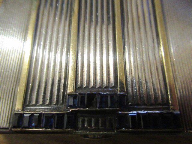 AN ART DECO SILVER COMPACT imported by Stockwell & Co. Image
