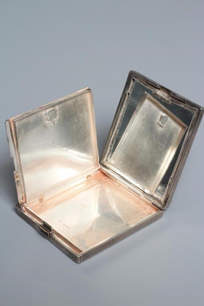 AN ART DECO SILVER COMPACT imported by Stockwell & Co. Image