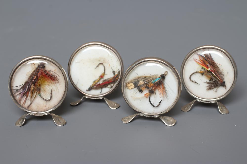 A SET OF FOUR EDWARDIAN NOVELTY SILVER MENU HOLDERS by Grey & Co. Image