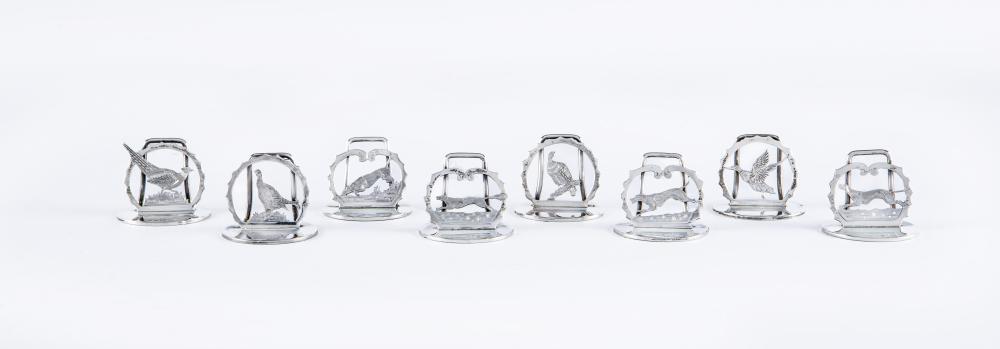 A COMPOSITE SET OF EIGHT SILVER NOVELTY MENU/PLACE CARD HOLDERS Image