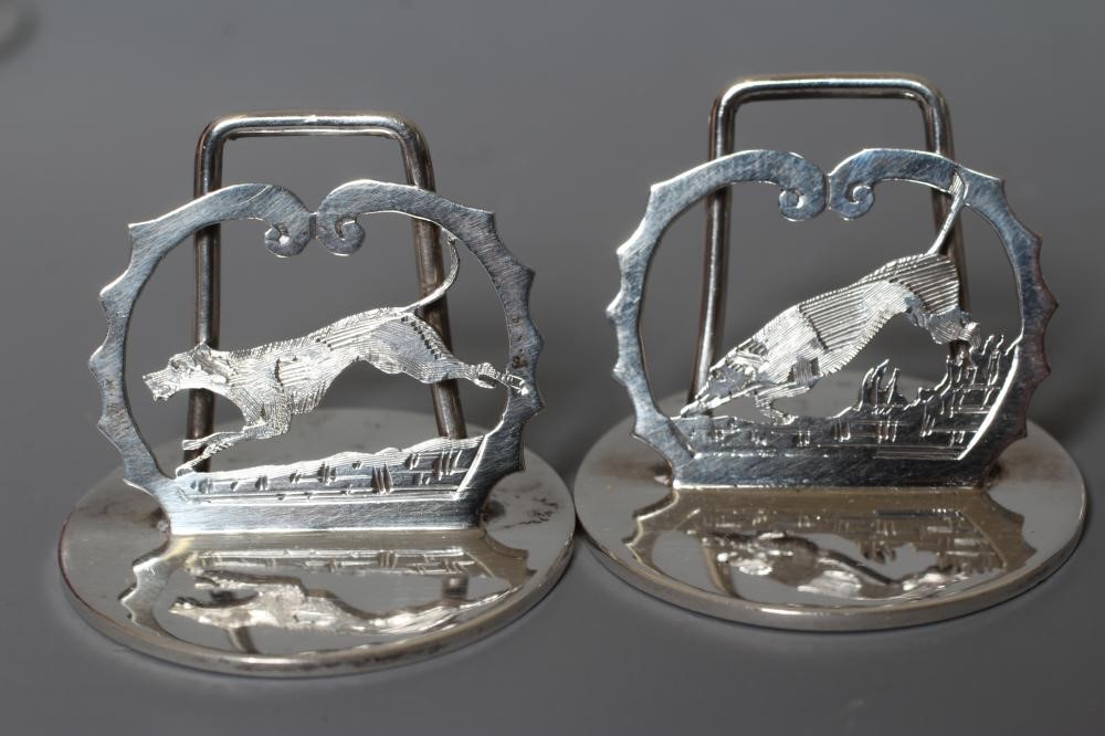 A COMPOSITE SET OF EIGHT SILVER NOVELTY MENU/PLACE CARD HOLDERS Image