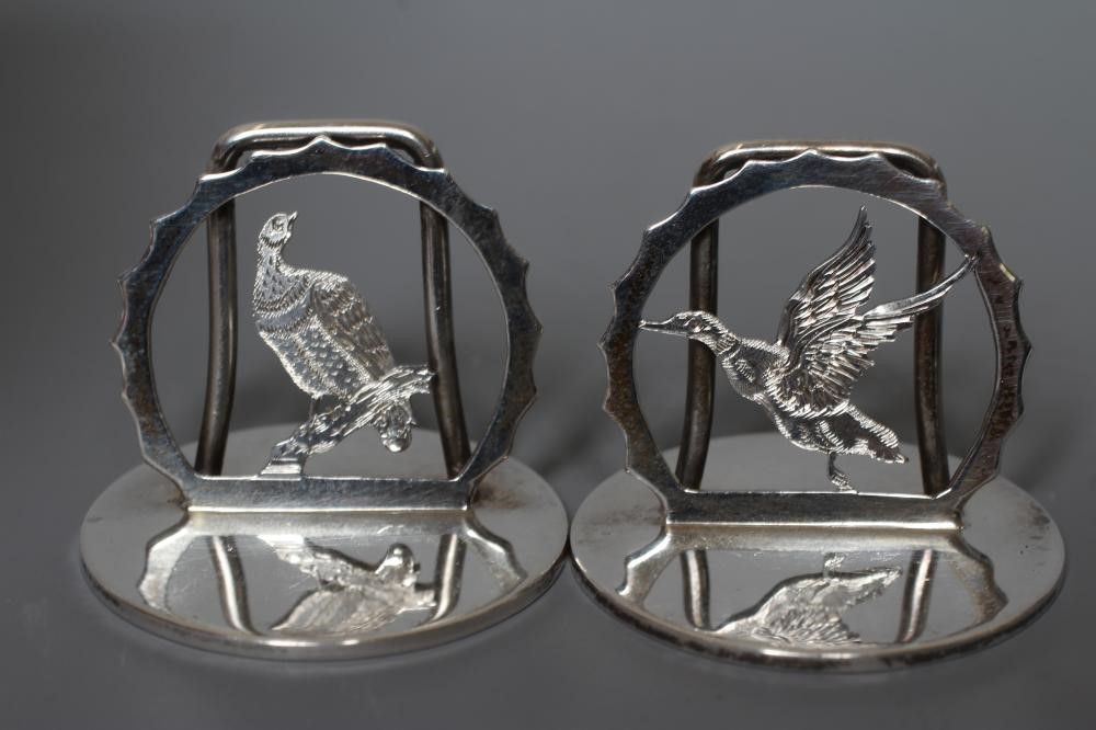 A COMPOSITE SET OF EIGHT SILVER NOVELTY MENU/PLACE CARD HOLDERS Image