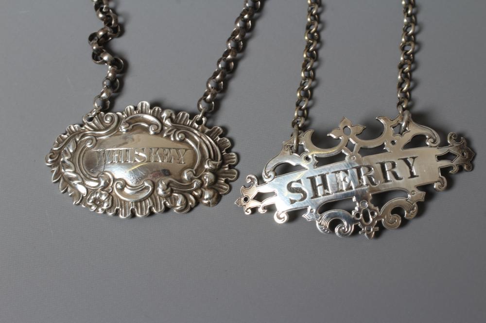 TWO VICTORIAN SILVER BOTTLE LABELS comprising 'Whiskey' by George Unite Image