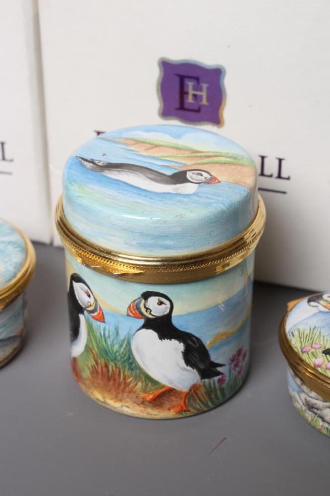 THREE ELLIOT HALL ENAMEL BOXES comprising a cylindrical box painted by Marie Graves with Puffins Image