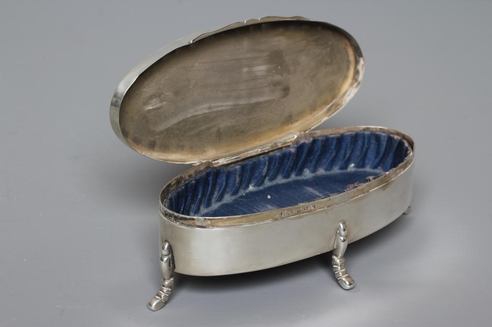 A SILVER OVAL DRESSING TABLE BOX by Hasset & Harper Ltd. Image