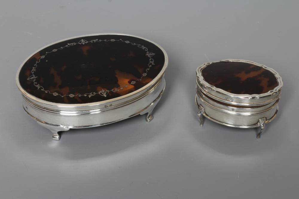 A SILVER OVAL DRESSING TABLE BOX by Adie Bros. Image