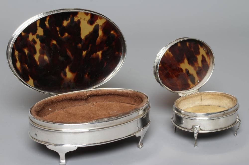 A SILVER OVAL DRESSING TABLE BOX by Adie Bros. Image
