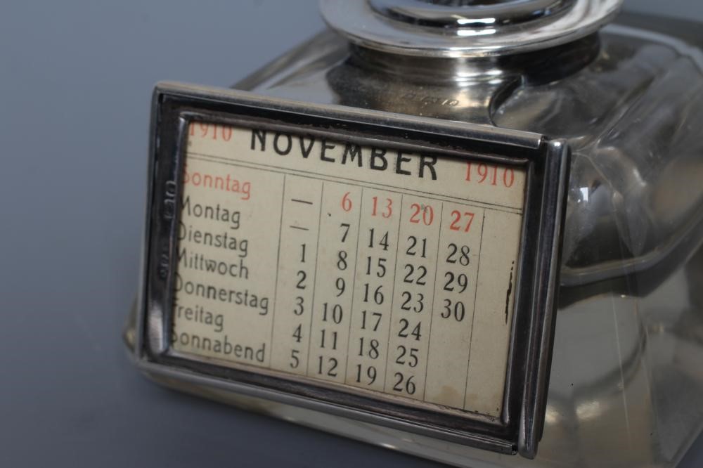 AN EDWARDIAN SILVER MOUNTED COMBINATION INKWELL/PERPETUAL CALENDAR AND WATCH HOLDER by John Grinsell Image