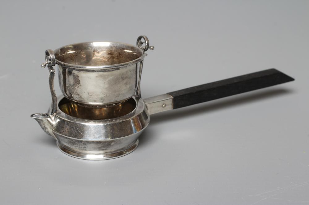 A SILVER TEA STRAINER ON STAND by Adie Brothers Ltd. Image