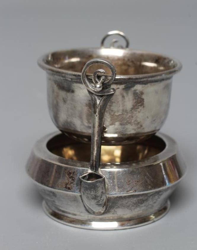 A SILVER TEA STRAINER ON STAND by Adie Brothers Ltd. Image