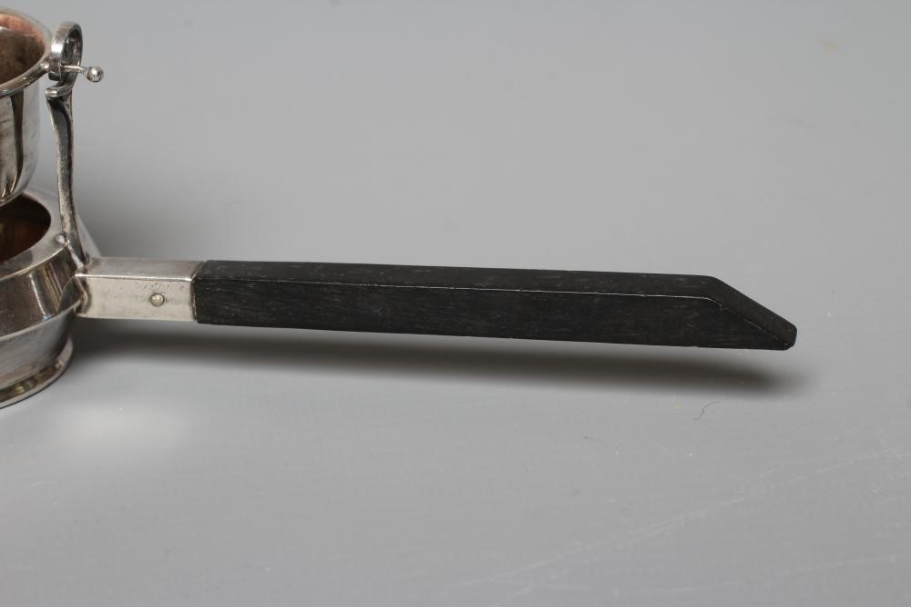 A SILVER TEA STRAINER ON STAND by Adie Brothers Ltd. Image
