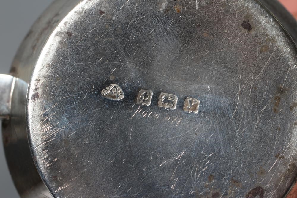 A SILVER TEA STRAINER ON STAND by Adie Brothers Ltd. Image