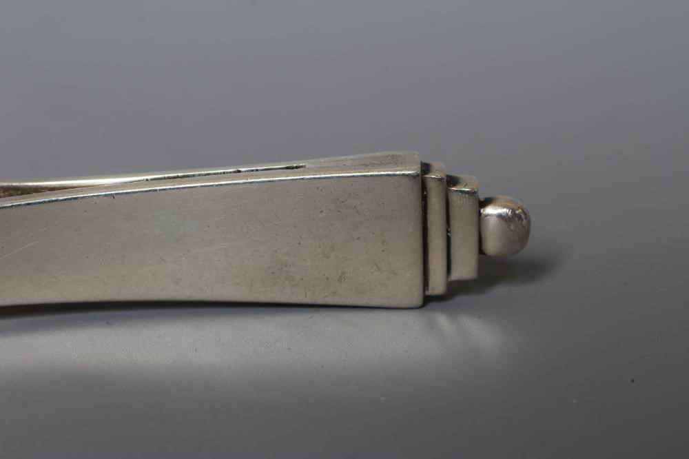 A PAIR OF GEORG JENSEN SILVER PYRAMID PATTERN SUGAR TONGS imported by Stockwell & Co., London 1929, Image
