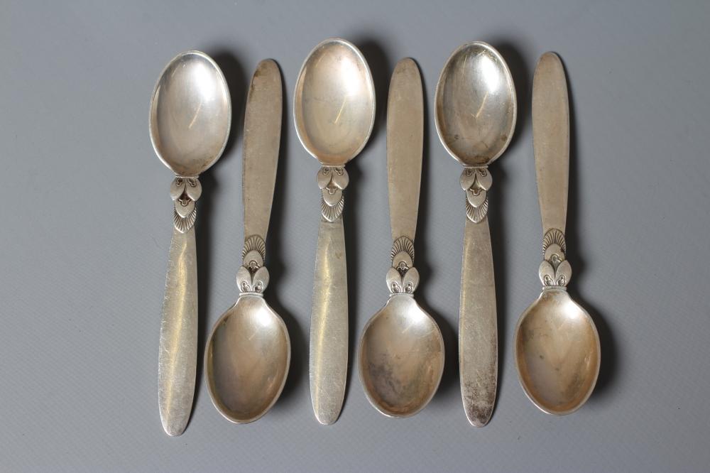 A SET OF SIX GEORG JENSEN SILVER CACTUS COFFEE SPOONS, London import 1938, 4" long, 3ozs total (Est. Image