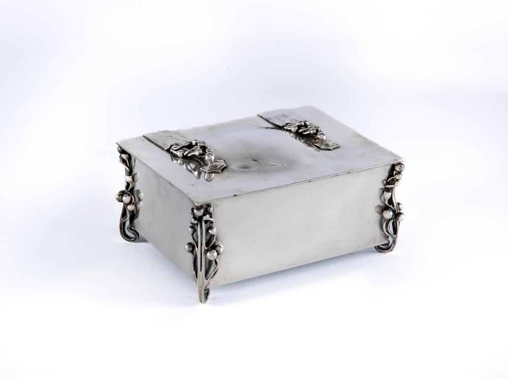 AN EDWARDIAN ARTS AND CRAFTS SILVER CIGARETTE CASKET by William Hutton Image