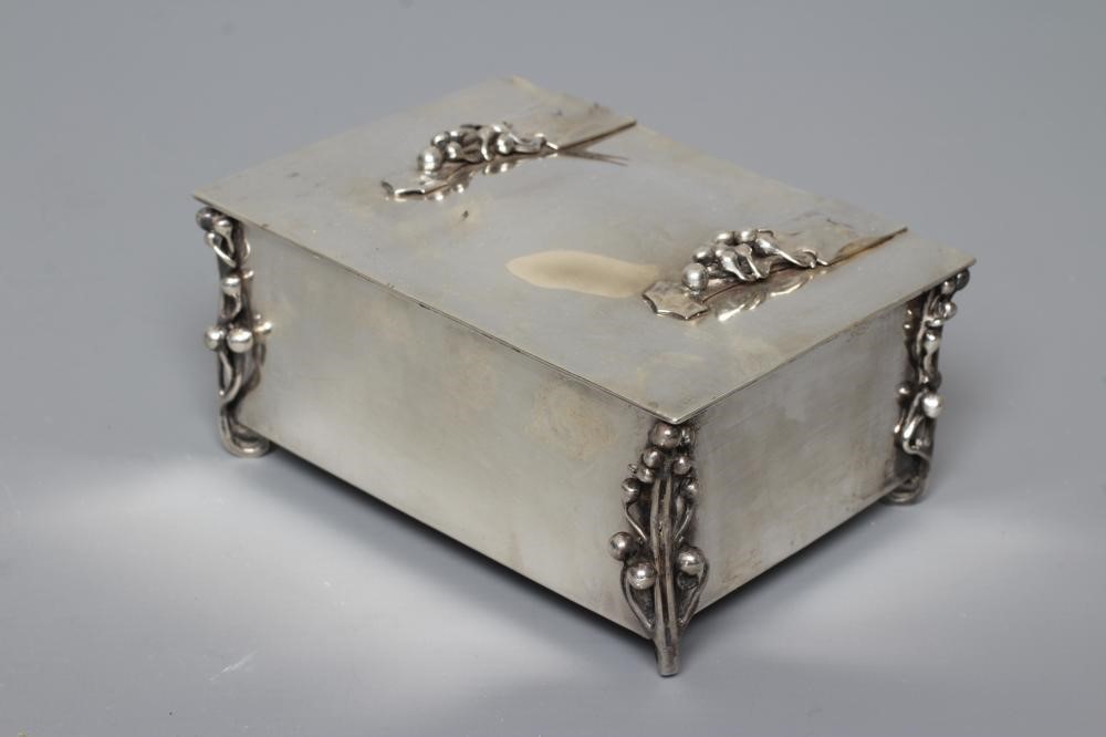 AN EDWARDIAN ARTS AND CRAFTS SILVER CIGARETTE CASKET by William Hutton Image