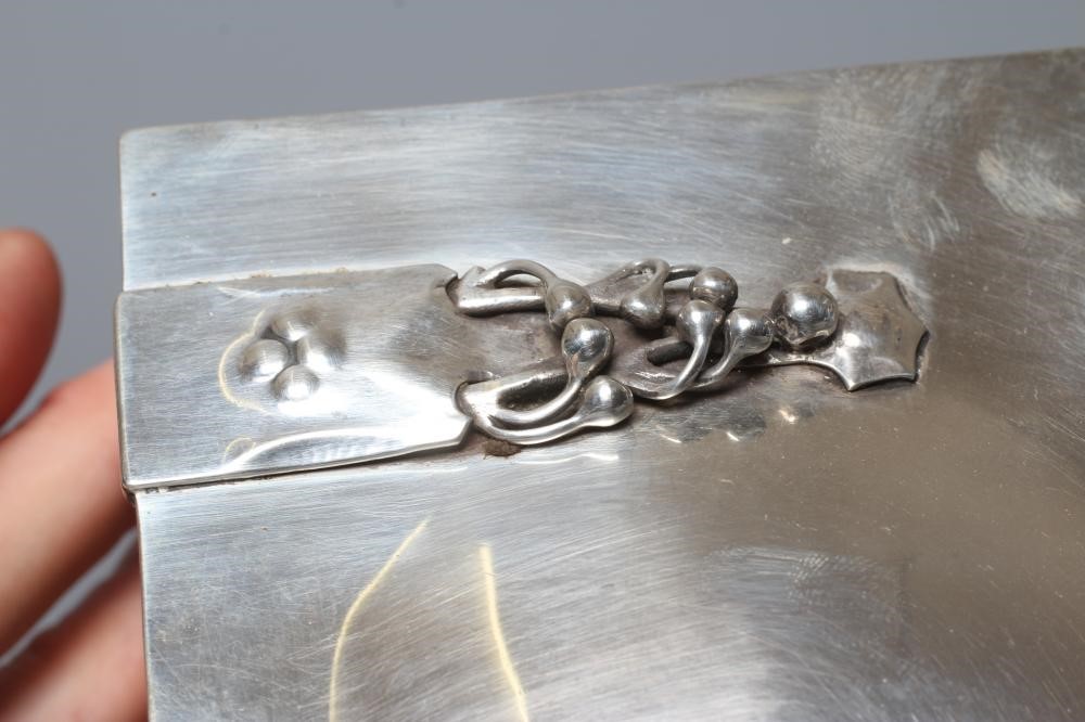 AN EDWARDIAN ARTS AND CRAFTS SILVER CIGARETTE CASKET by William Hutton Image