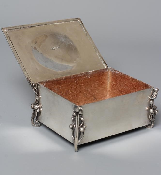 AN EDWARDIAN ARTS AND CRAFTS SILVER CIGARETTE CASKET by William Hutton Image