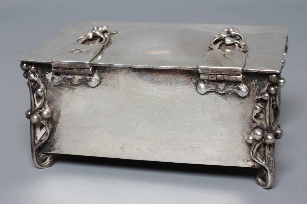 AN EDWARDIAN ARTS AND CRAFTS SILVER CIGARETTE CASKET by William Hutton Image