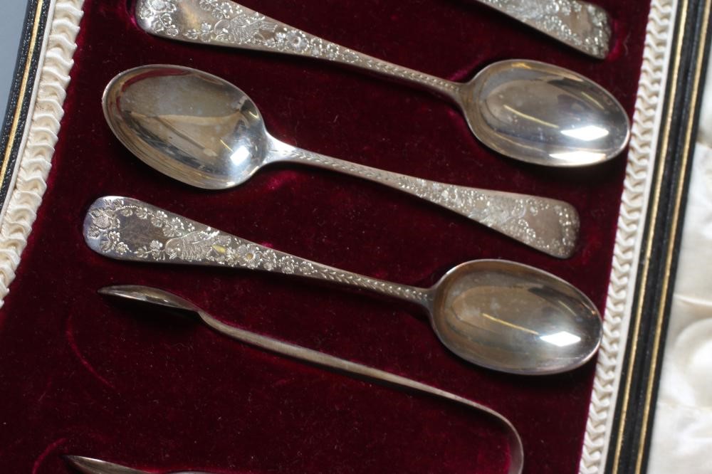 A SET OF TWELVE EDWARDIAN SILVER TEASPOONS AND MATCHING SUGAR TONGS by Wakely & Wheeler Image