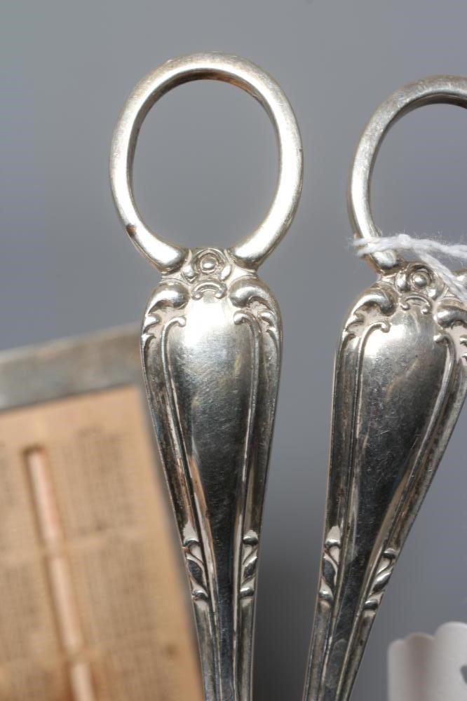 AN EDWARDIAN SILVER EASEL BACK PERPETUAL DESK CALENDAR by William T. Bell Image