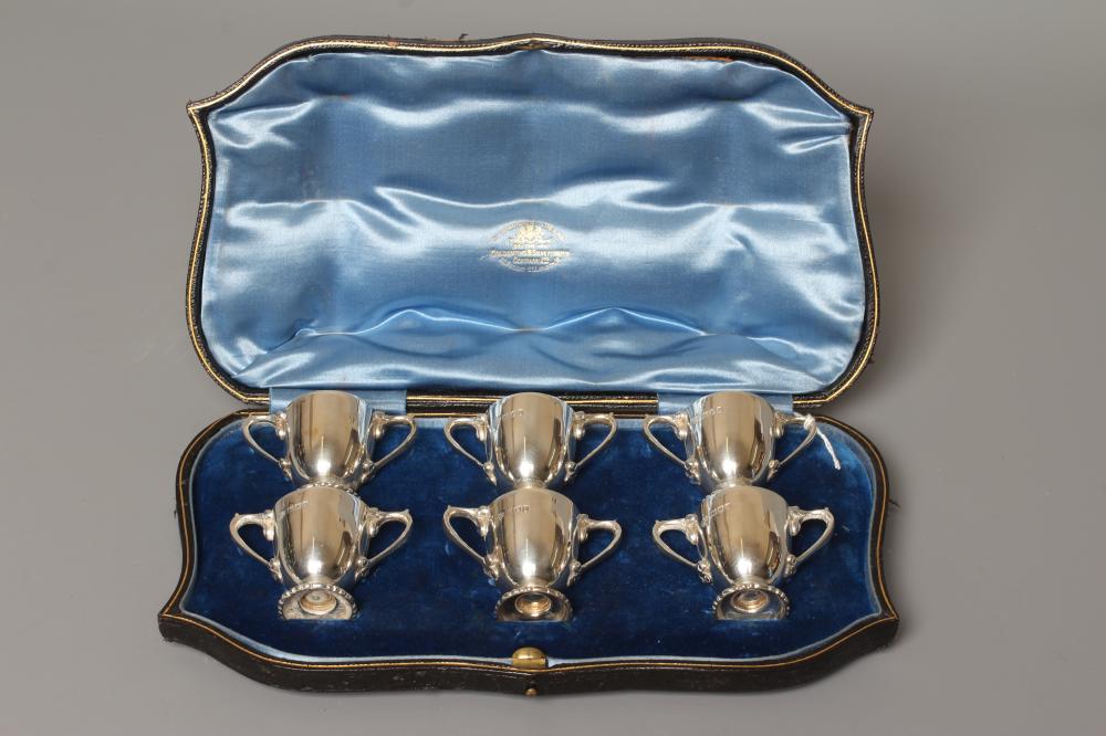 A SET OF SIX EDWARDIAN SILVER MINIATURE TWO HANDLED TROPHY CUPS by Goldsmith's & Silversmith's Co. Image
