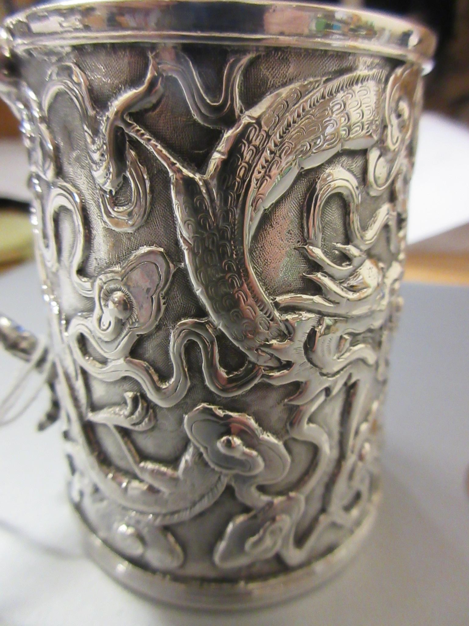 A CHINESE EXPORT SILVER CHRISTENING MUG by Kwong Man Shing (act.1875-1925) Image