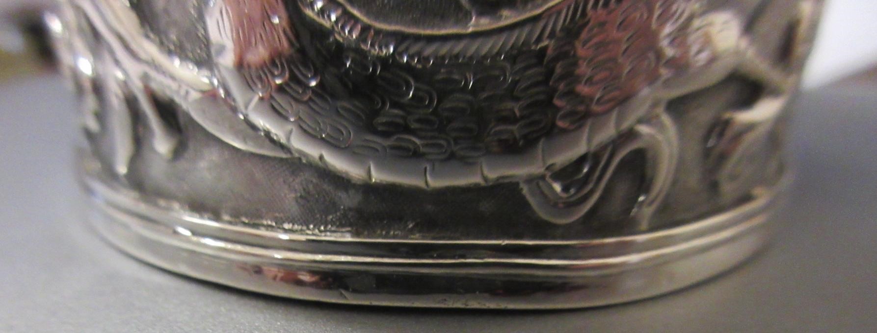 A CHINESE EXPORT SILVER CHRISTENING MUG by Kwong Man Shing (act.1875-1925) Image