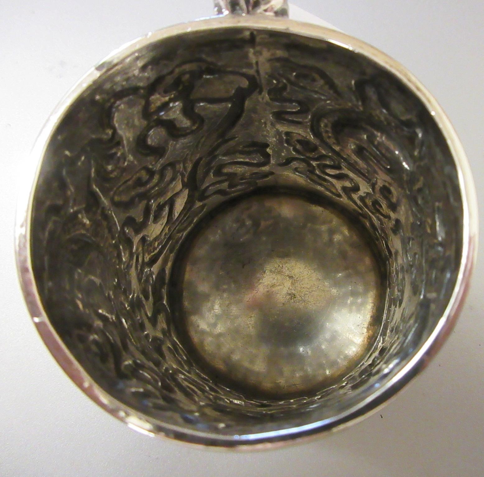A CHINESE EXPORT SILVER CHRISTENING MUG by Kwong Man Shing (act.1875-1925) Image