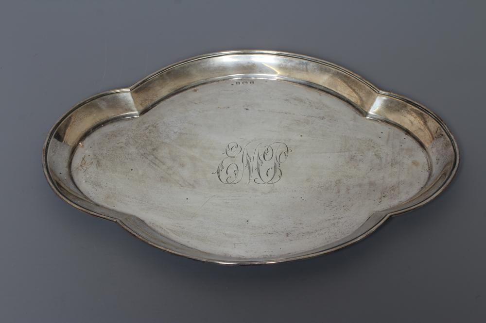 A SILVER DRESSING TABLE TRAY, maker's mark rubbed, Birmingham 1914, of lobed oval form centrally Image