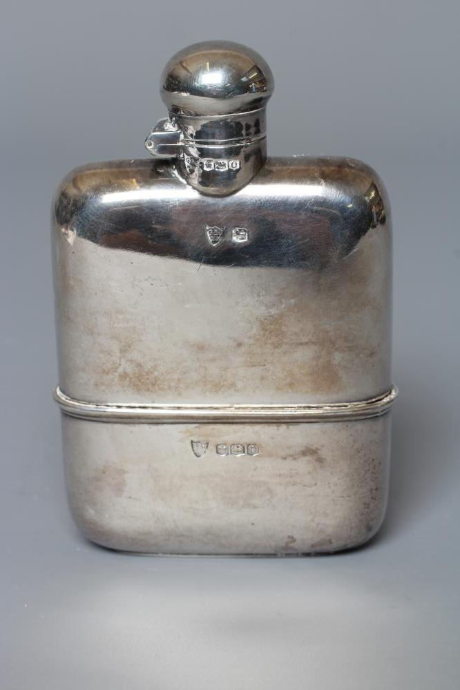 A SILVER HIP FLASK by G & J W Hawksley, Sheffield 1931, of plain rounded oblong form with pull-off Image