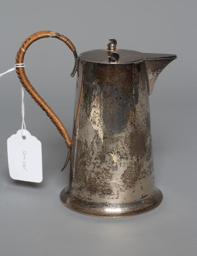 AN EDWARDIAN SILVER HOT MILK JUG by Barker Brothers Image