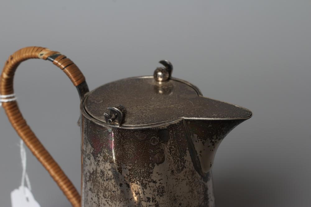 AN EDWARDIAN SILVER HOT MILK JUG by Barker Brothers Image