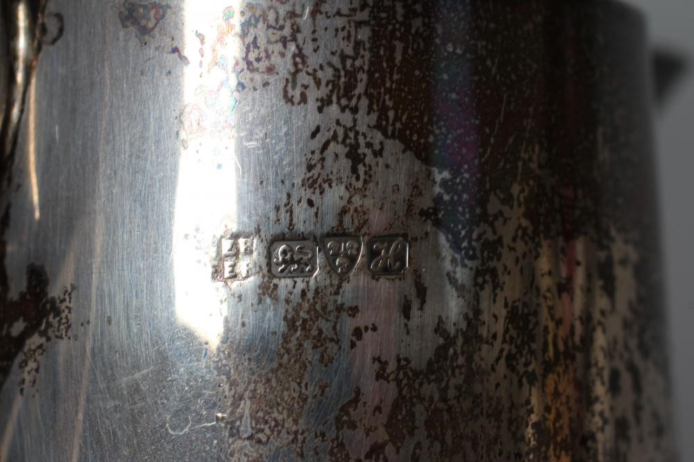 AN EDWARDIAN SILVER HOT MILK JUG by Barker Brothers Image