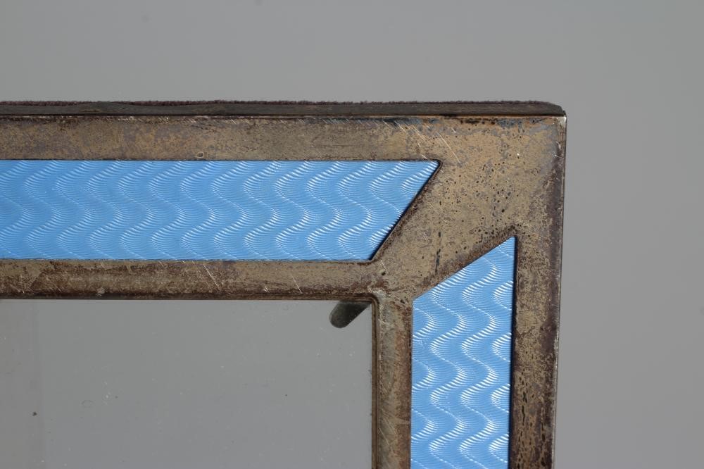 AN ART DECO STYLE SILVER PHOTOGRAPH FRAME by Roberts & Dore Ltd. Image