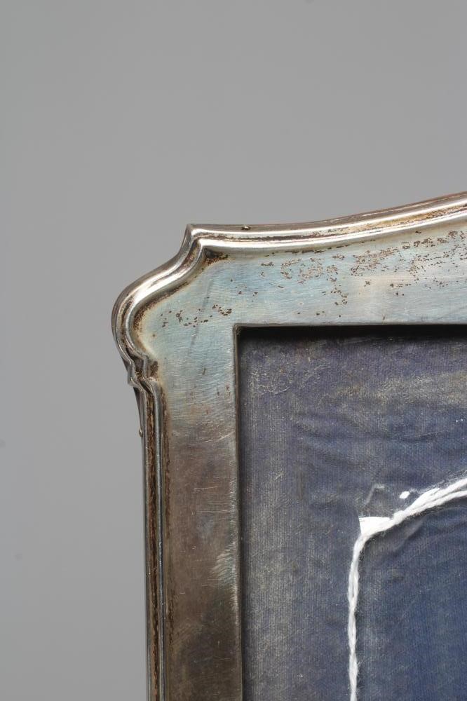 A SILVER PHOTOGRAPH FRAME by Walker & Hall Image