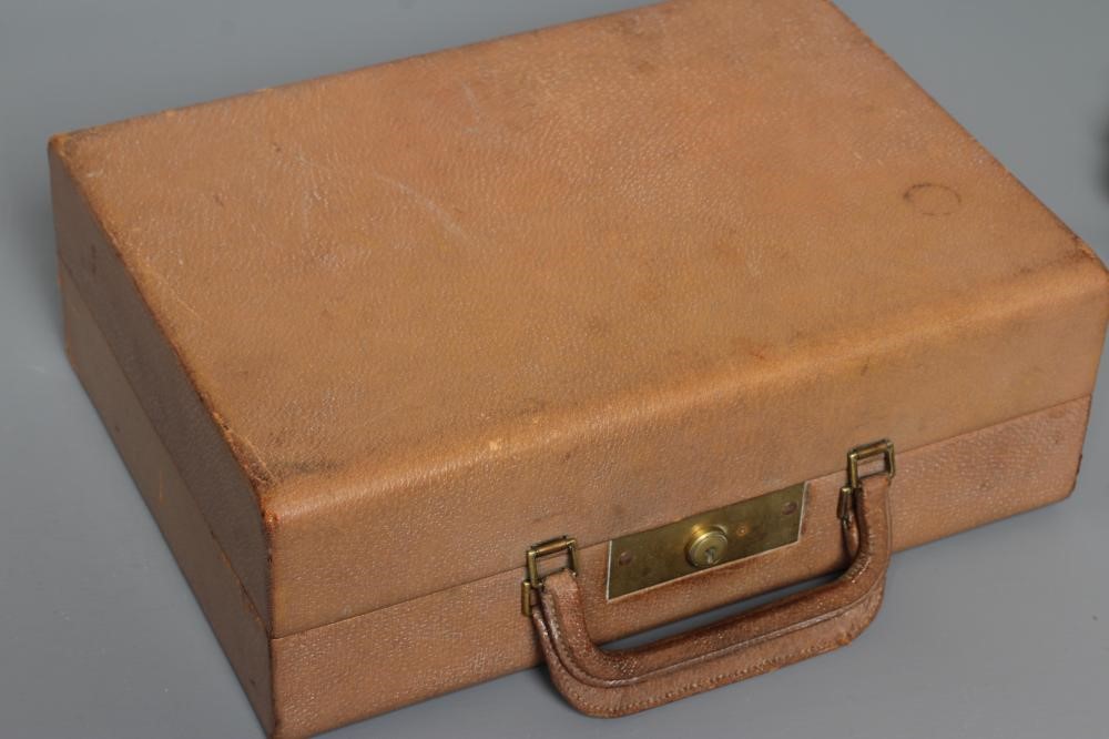 AN ART DECO ELEVEN PIECE SILVER TRAVELLING DRESSING SET Image