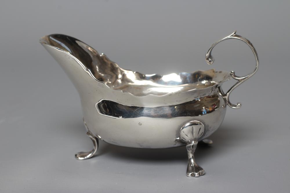 A GEORGE III SMALL SILVER SAUCEBOAT by Samuel James Image
