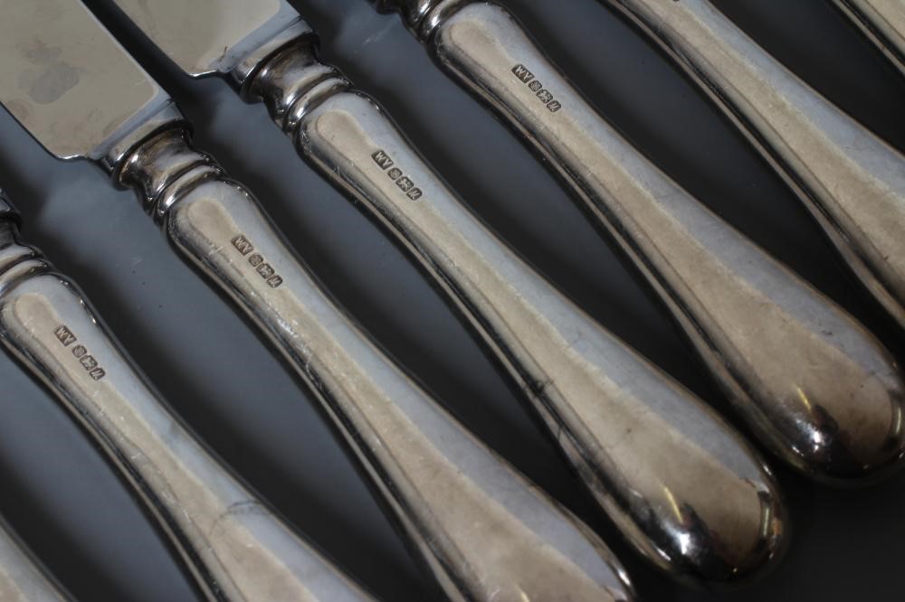 A SET OF ELEVEN OLD ENGLISH PATTERN SILVER HANDLED TABLE KNIVES by William Yates Ltd., Sheffield Image