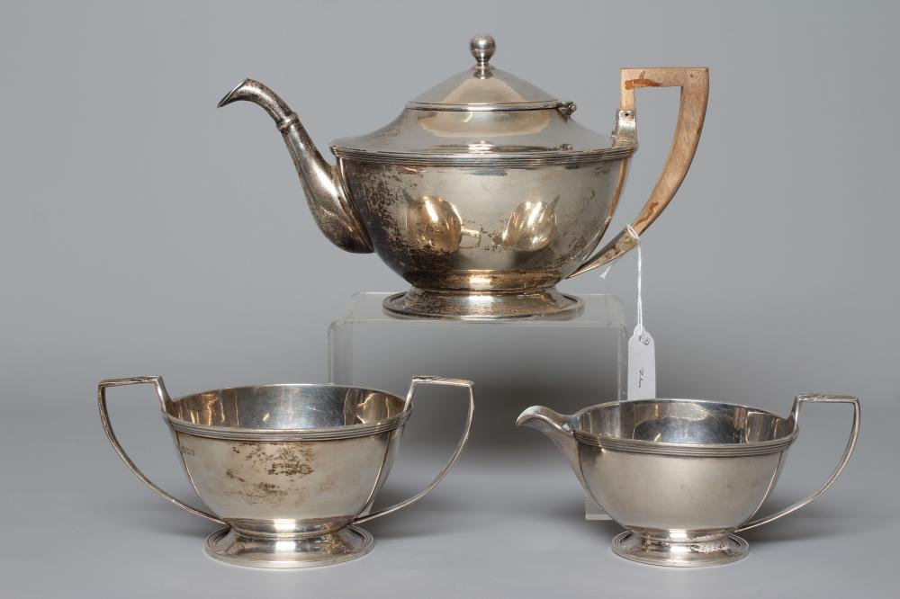 A THREE PIECE SILVER TEA SERVICE by D & J Wellby Ltd. Image