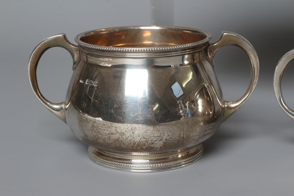 A COMPOSITE THREE PIECE SILVER TEA SERVICE by Mappin & Webb Image