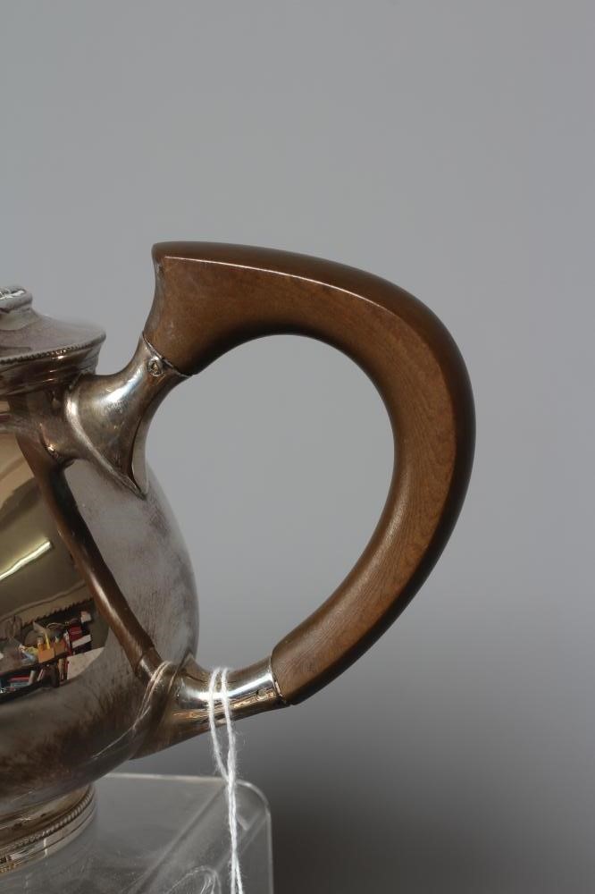 A COMPOSITE THREE PIECE SILVER TEA SERVICE by Mappin & Webb Image