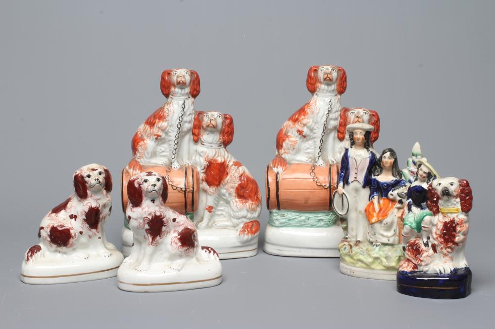 A COLLECTION OF VICTORIAN POTTERY SPANIELS comprising a pair of spaniels with a barrel Image