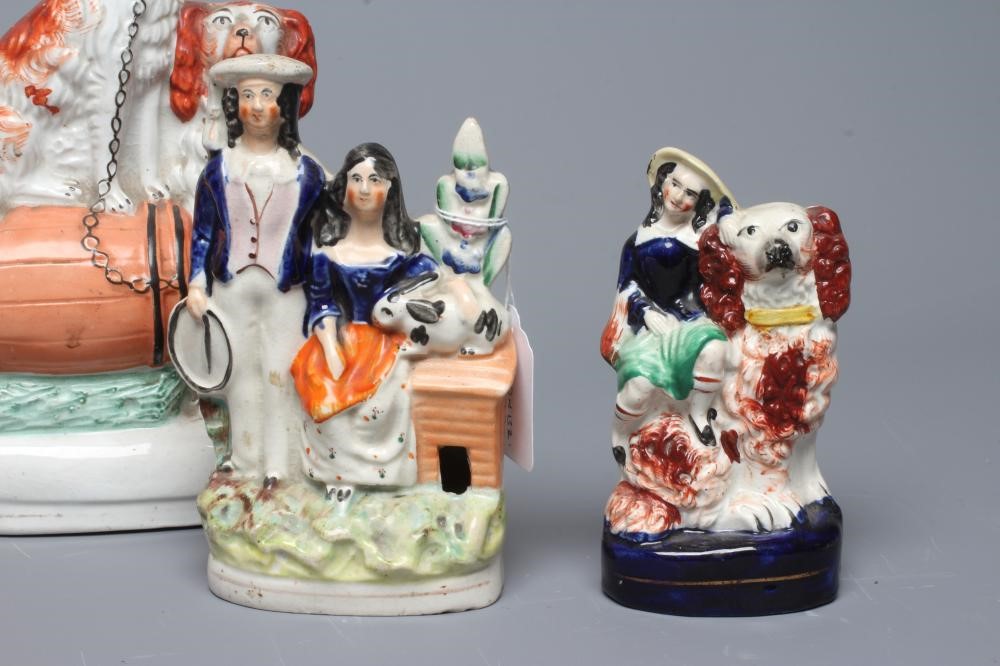 A COLLECTION OF VICTORIAN POTTERY SPANIELS comprising a pair of spaniels with a barrel Image