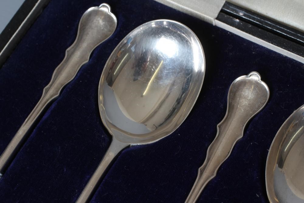 A SET OF SIX CHIPPENDALE PATTERN SILVER SOUP SPOONS by Josiah Williams & Co., London 1918, 8ozs Image